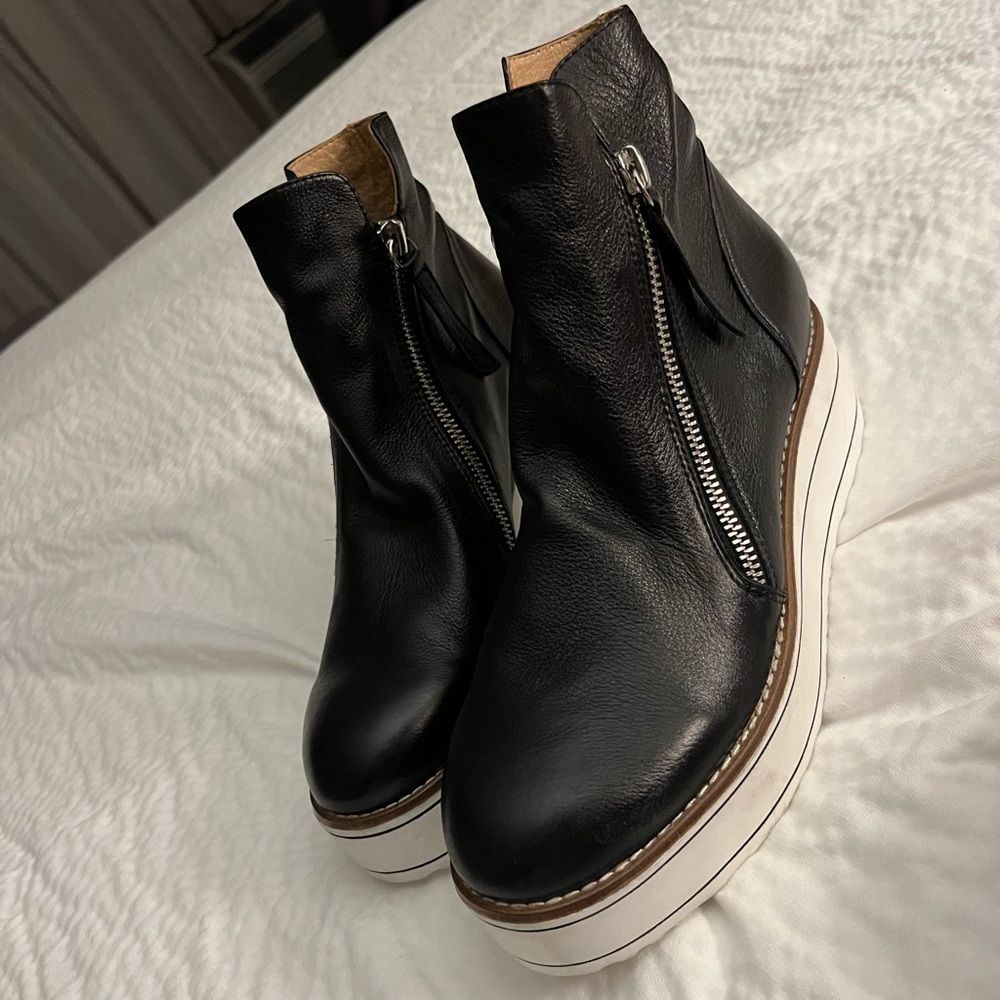Stylish booties with white chunky bottoms
